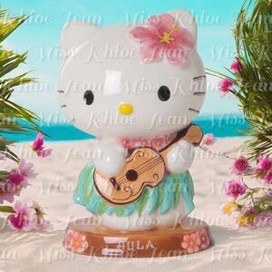 - HELLO KITTY HULA FIGURINE
